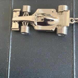 Vintage Collectible Silver Racecar Keychain. This is a solid piece